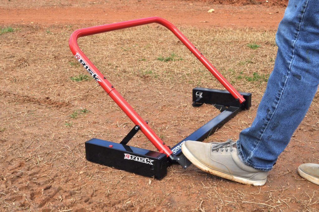 foot pressing the pedal to reset the Holeshot Starting Gate by Risk Racing